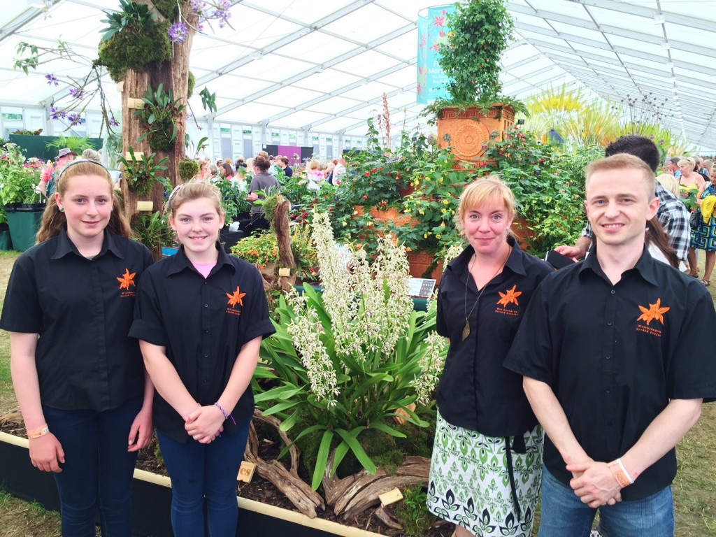 Bristol Aquarium's Wendy Desyllas and Matt Orlik, right, with students from Writhlington School and their orchid display at Hampton Court Flower Show